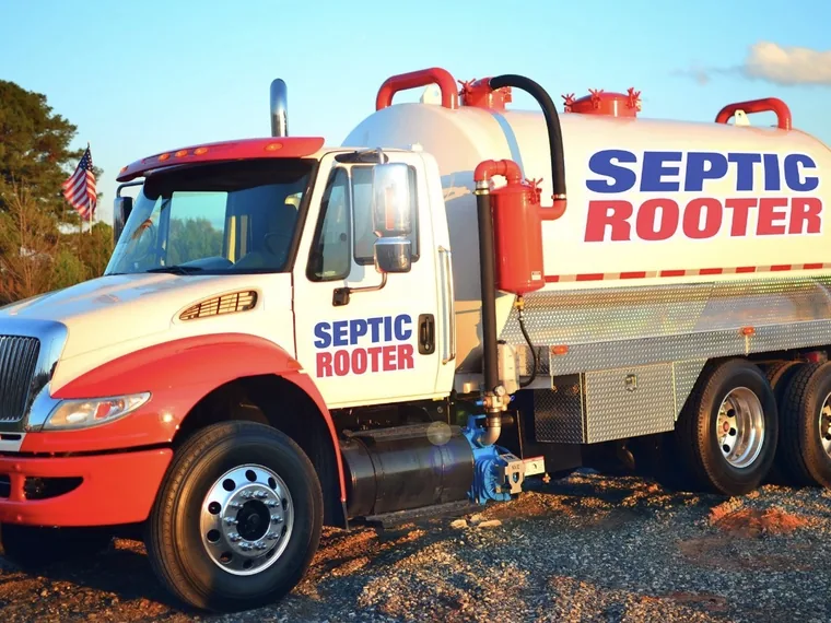 Clean SepticRooter pump truck with an American flag